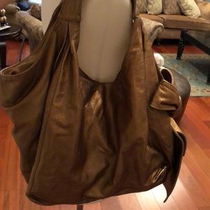 Valentino gold with bow shoulder bag.